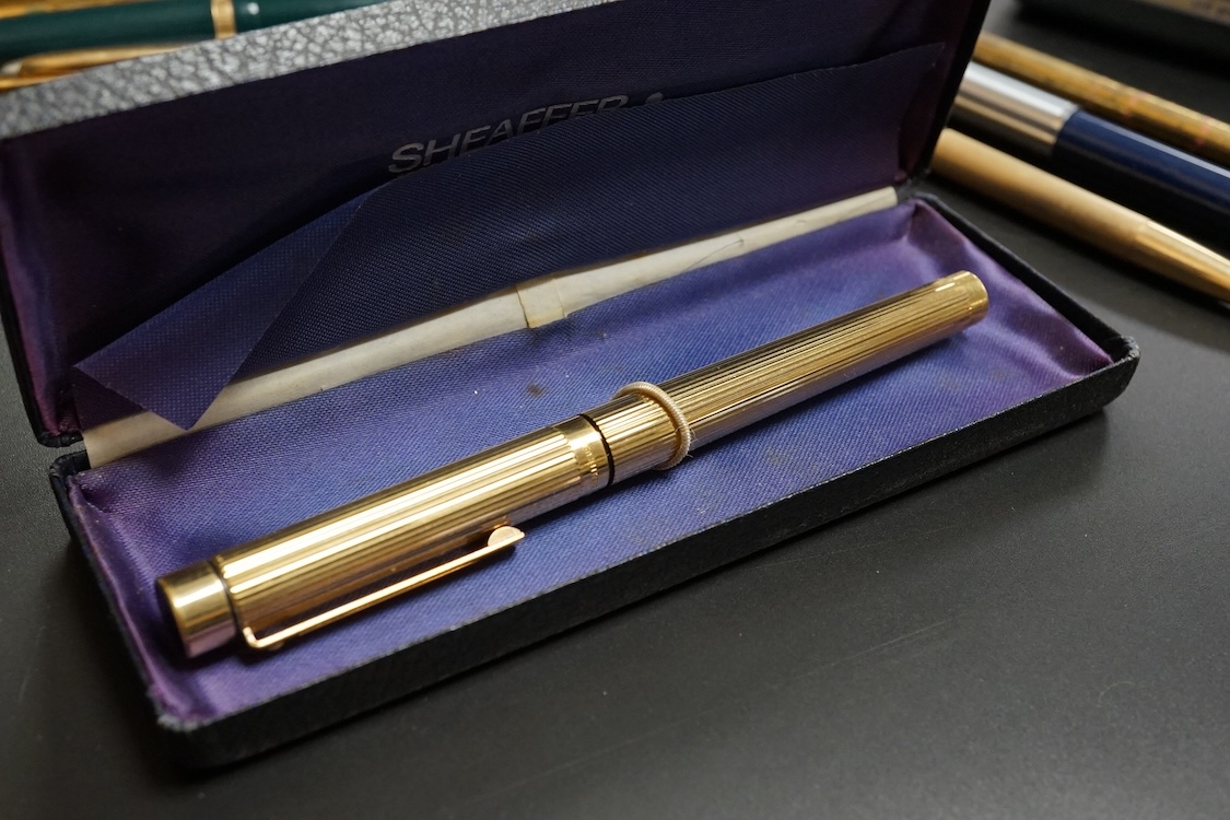 Four assorted cased Waterman pens, elven other assorted pens including Scheaffer and Parker and an engine turned silver pen.
